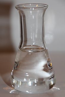 A flask with Glycerine, a clear and syrupy liquid.