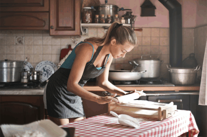 A women in a rodent free cooking area preparing food. All Natural rodent repellent by Minus Bite